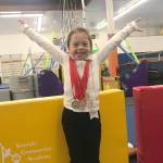Kirklands Frannie Ronan strikes a gymnastics pose while sporting her medals from the state qualifying meet for the 2018 Special Olympics USA Games. Courtesy photo