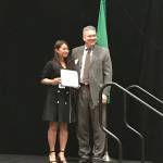 Interlake High School graduate, Valerie Tse, accepts the M. Gail Ryder Scholarship award on stage. Tse plans on attending the University of Washington to continue her higher education. Hanson Lee/staff photo