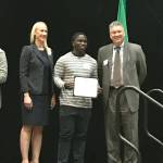 Bellevue High School graduate, DJ Wulah, accepts the Ralph James Family Memorial Scholarship on stage. Wulah plans on attending the University of Redlands to continue his higher education. Hanson Lee/staff photo