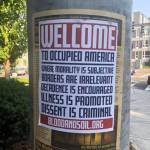 The white supremacist posters hung for less than a day between Crossroads and the St. Louise Church. Photo courtesy of Rebecca Schaechter