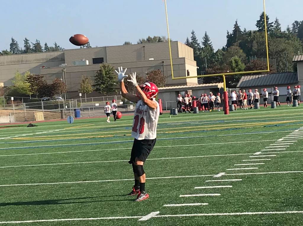 Knights senior receiver Roman Morrison focuses on a pass thrown in his direction on Aug. 17. Shaun Scott/staff photo