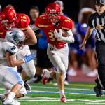 Newport Knights running back Roman Morrison rumbles for a 47-yard touchdown run against the Interlake Saints in the season opener on Aug. 31 in Factoria. Photo courtesy of Patrick Krohn/Patrick Krohn Photography