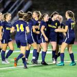 Bellevue players celebrate after scoring a goal against the Lake Washington Kangaroos. Bellevue trailed Lake Washington 2-0 at halftime but scored two goals in the second half to tie the game. After two-five minute overtime sessions, the game ended in a 2-2 draw on Sept. 13 at Bellevue High School. Photo courtesy of Rick Edelman/Rick Edelman Photography