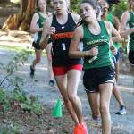 Newport senior Alyssa Bienfang, left, won the girls varsity 5K cross country meet in 19 minutes, 49 seconds against Redmond and Woodinville on Sept. 19 at Hartman Park in Redmond. Here, she goes stride for stride with Redmond sophomore Chloe Connolly, who took second in 19:50, in the 4A KingCo meet. Andy Nystrom / staff photo