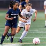 The Interlake Saints girls soccer squad earn a 2-0 win against the Sammamish Totems on Sept. 20 in Bellevue. Interlake improved to 2-4-1 overall with the victory. The Totems dropped to 2-3 with the loss. Interlake senior Phennah Reid, left, battles with Totems sophomore Kate Wilken, right, for possession of the ball. Photo courtesy of Patrick Krohn/Patrick Krohn Photography