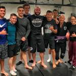 Bellevue police pose with Adem Redzovic, a jiu-jitsu practitioner who was brought in by officer Craig Hanaumi to give a seminar at the BPD. Photo courtesy of the Bellevue Police Department and Craig Hanaumi