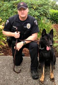Bellevue Police K-9 Jack, shown here with his handler Officer Tim Stoutt, served the residents of Bellevue for more than seven years. Photo courtesy of the Bellevue Police Department