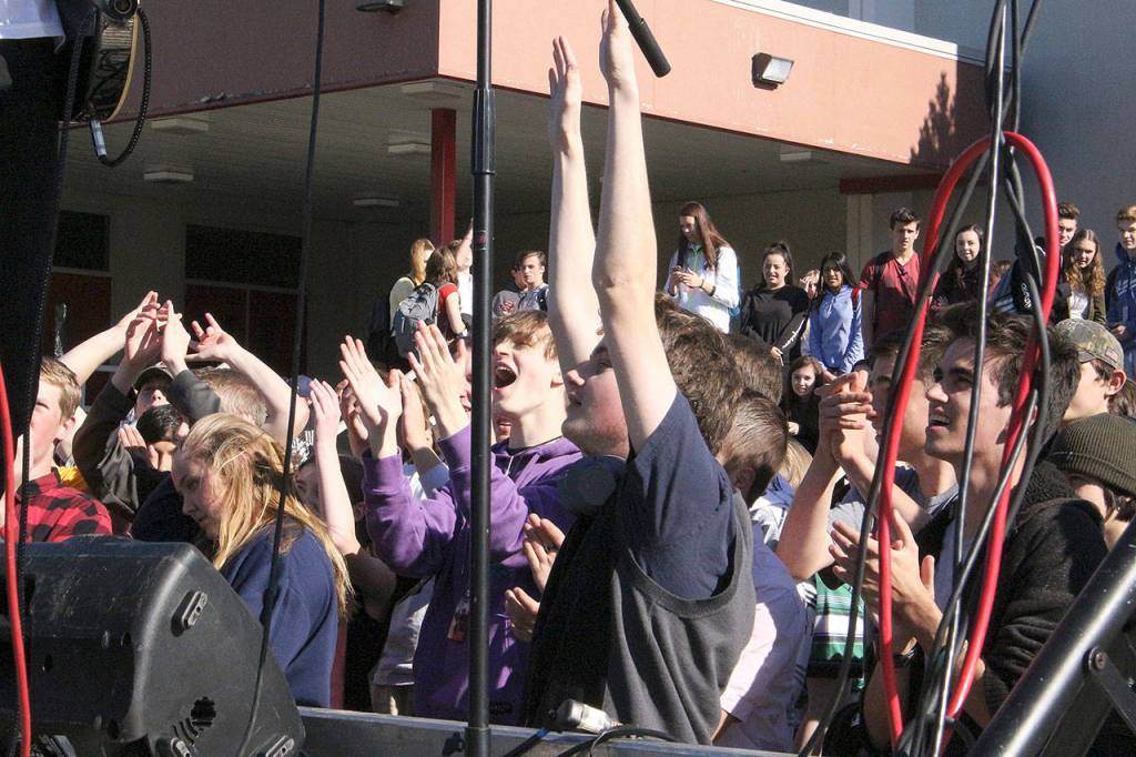 Mt. Si High School students form a mosh pit in front of Gypsy Temples truck bed stage. Madison Miller/staff photo.