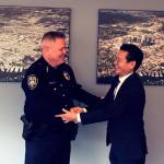 Bellevue city manager Brad Miyake welcomes Steve Mylett back to his position as police chief following his exoneration. Photo courtesy of the city of Bellevue