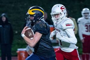 Bellevue Wolverines junior running back Alex Reid breaks free for a long gain against the Snohomish Panthers. Reid had two rushing touchdowns in Bellevues 66-33 victory against the Panthers on Nov. 9 at Bellevue Memorial Stadium. Photo courtesy of Stephanie Ault Justus