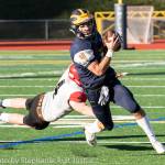 Bellevue Wolverines senior quarterback Joey Echigoshima, who has been the starting quarterback for the past two seasons, rumbles for yardage against the Yelm Tornados in the Class 3A state quarterfinals on Nov. 17 at Bellevue Memorial Stadium. Photo courtesy of Stephanie Ault-Justus