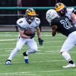 Bellevues Joby Schneider runs the ball up field against Eastside Catholic. Photo courtesy of Stephanie Ault Justus