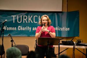 Tulin Yildiz speaks on the origin and significance of ashure in Turkish culture at Turkchas event at the Peter Kirk Community Center in Kirkland. Photo courtesy of Dilek Anderson