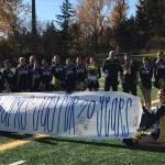 Bellevue Wolverines spotter Jay Honda (center with #64 jersey on) was honored for 20 years of volunteer service to the Bellevue Wolverines football program prior to the start of the Wolverines/Yelm Tornados Class 3A state quarterfinal matchup on Nov. 17 at Bellevue Memorial Stadium. The 2018 season was Hondas final season as the Wolverines spotter in the press box. Photo courtesy of the Bellevue Wolverines football program Twitter feed