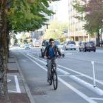 A cyclist rides along the Downtown Demonstration Bikeway during the projects grand opening on July 31, 2018. Courtesy Photo