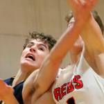 Bellevue player McCallum Mead, left battles Juanitas Nathan Robertson in the paint during a 3A KingCo contest on Dec. 4 at Juanita High School in Kirkland. The Wolverines defeated the Rebels 61-48 to improve their overall record to 1-1. Andy Nystrom, staff photo