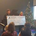 King County Council Vice Chair Claudia Balducci presented Music Works Northwest, a $45,200 check on Dec. 2. Photo courtesy of King County