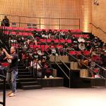 Dr. David Stovall speaks to more than 100 Bellevue School District high school students about school versus education and how to be wary of those trying to manipulate them at the fourth annual BOOM Experience at Bellevue College. Madison Miller/staff photo.
