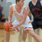 Newport Knights center Braeden Splaine, left, looks to make a pass while being covered by Mount Si senior Brett Williams, right, in a 4A KingCo matchup on Dec. 14 in Factoria. Mount Si defeated Newport, 66-44, in the contest. Photo courtesy of Patrick Krohn/Patrick Krohn Photography