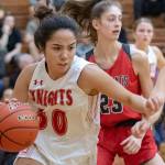 Newport Knights senior guard Anateya Sommerville, left, drives to the hoop while being defended by Mount Si Wildcats senior Savanna Samuelson, right, in a 4A KingCo contest on Dec. 14 at Newport High School. The Knights earned a comeback 45-36 victory against the Wildcats. Photo courtesy of Patrick Krohn/Patrick Krohn Photography