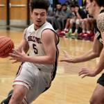 Bellevue Bulldogs mens basketball player Curtis Walker drives to the basket in a game earlier this season. Walker is averaging 13 rebounds per game through eight games. Photo courtesy of Kwame Kang