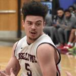 Bellevue Bulldogs mens basketball player Curtis Walker drives to the basket in a game earlier this season. Walker is averaging 13 rebounds per game through eight games. Photo courtesy of Kwame Kang