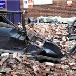 As seen on March 4, 2001, a large van was crushed by earthquake debris                                in a Seattle parking lot. FEMA News Photo by Kevin Galvin                                As seen on March 4, 2001, a large van was crushed by earthquake debris in a Seattle parking lot. FEMA News Photo by Kevin Galvin