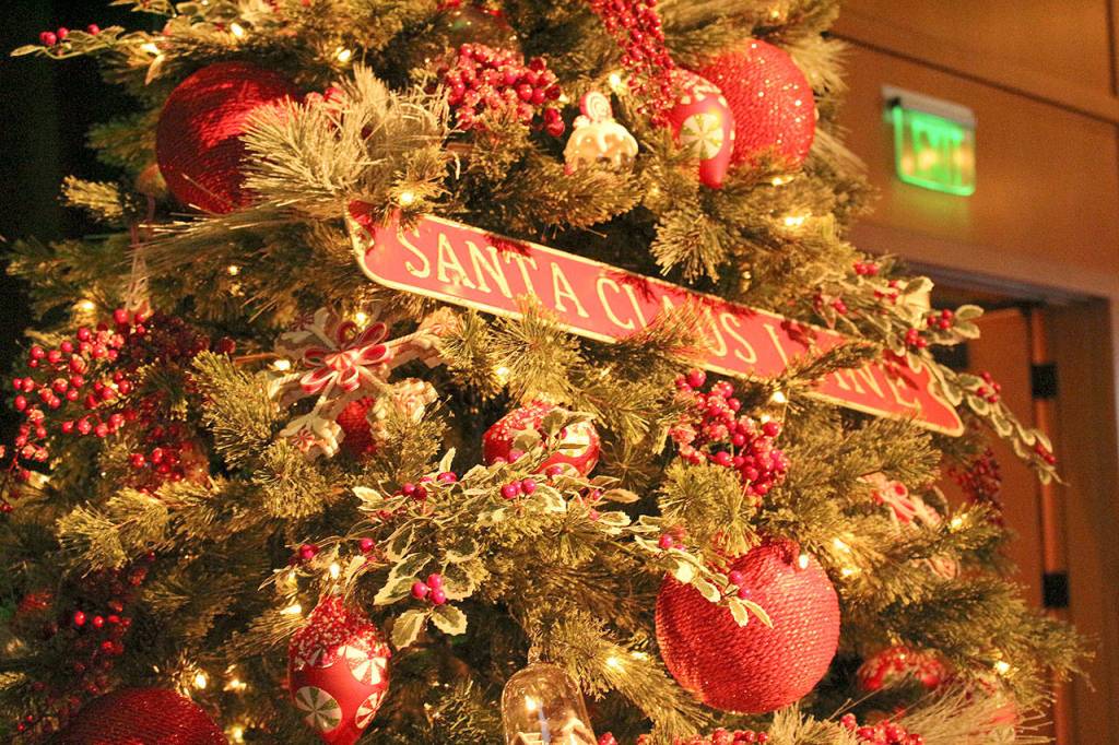 A Gingerbread Christmas Tree, designed by Garrett and Tina Oiness, IVY Gift Home was sponsored by the Bacon Family Foundation. The 7.5 foot tree is decorated in a traditional palette of green, white and red and adorned with gingerbread ornaments and accents of peppermint candies. Madison Miller/staff photo.