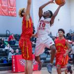 Sammamish Totems junior Adama Drammeh (No. 10) takes the ball to the hoop against the Franklin Pierce Cardinals in a non-league contest on Jan. 3 in Bellevue. Drammeh finished with a total of nine points in the loss. Photo courtesy of Patrick Krohn/Patrick Krohn Photography