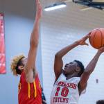 Sammamish Totems junior Adama Drammeh (No. 10) takes the ball to the hoop against the Franklin Pierce Cardinals in a non-league contest on Jan. 3 in Bellevue. Drammeh finished with a total of nine points in the loss. Photo courtesy of Patrick Krohn/Patrick Krohn Photography