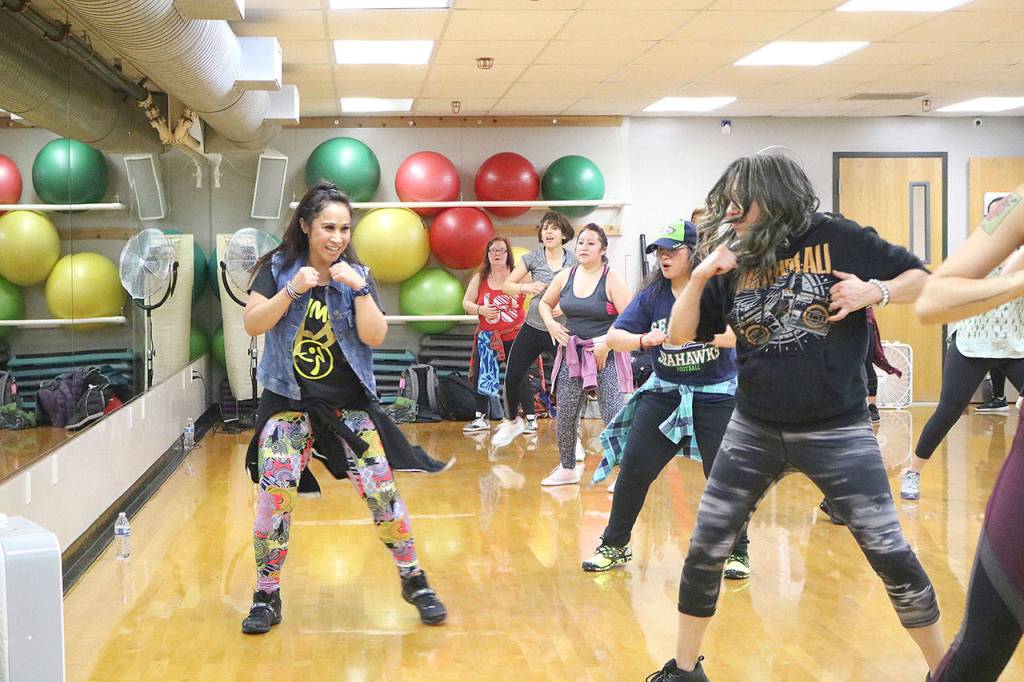 The two-hour event was led by eight Zumba instructors. Zumba instructor Trina Martini led a dance on Jan. 5 at the YMCA in Bellevue. Stephanie Quiroz/staff photo.