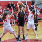 Newport Knights senior post player Sophia Dominitz, center, looks for a teammate to pass the ball to in a matchup against Mount Si Wildcats. Newport defeated Mount Si, 43-37, on Jan. 16 in Snoqualmie. Photo courtesy of Patrick Krohn/Patrick Krohn Photography
