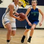 The Bellevue Wolverines girls basketball team earned a 47-44 victory against the Liberty Patriots on Jan. 30. The Wolverines improved their overall record to 9-10 with the win. Bellevue senior Montana Jones, left, prepares to make a pass down the court while being chased by Liberty shooting guard Grace Moawad during the matchup between KingCo rivals. Photo courtesy of Stephanie Ault Justus