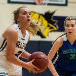 The Bellevue Wolverines girls basketball team earned a 47-44 victory against the Liberty Patriots on Jan. 30. The Wolverines improved their overall record to 9-10 with the win. Bellevue senior Montana Jones, left, prepares to make a pass down the court while being chased by Liberty shooting guard Grace Moawad during the matchup between KingCo rivals. Photo courtesy of Stephanie Ault Justus