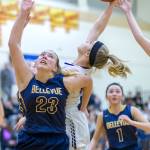 Bellevue Wolverines sophomore Sara Bowar, left, boxes out a Lake Washington player while trying to grab a rebound in the 3A KingCo tournament championship game on Feb. 6 at Newport High School in Factoria. Photo courtesy of Patrick Krohn/Patrick Krohn Photography