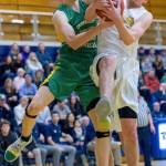 Bellevue Wolverines senior Hunter Hansen, right, and Bishop Blanchets Cade Prinizivalli, left, battle for a rebound in the paint on Feb. 14 at Bellevue High School. Hansen scored a team-high 17 points for the Wolverines. Photo courtesy of Patrick Krohn/Patrick Krohn Photography