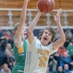 Bellevue sophomore forward Hudson Hansen, right, goes up strong to the basket in a loser-out, playoff game against Bishop Blanchet on Feb. 14. Bellevue defeated Bishop Blanchet 49-35. Photo courtesy of Patrick Krohn/Patrick Krohn Photography