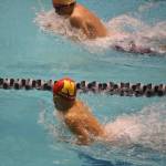Newports Dylan Ling, bottom, competes in the 200 medley relay at state. Newport took second in 1:34.91. Andy Nystrom / staff photo