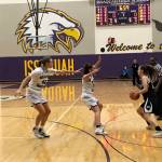 Bellevue Christian defenders Sophia Bold, center, and Molly Olson, left, converge on a Meridian senior Alexis Groen, right, in the first quarter of a regional playoff game on Feb. 23 at Issaquah High School. Meridian defeated Bellevue Christian 40-26. Shaun Scott, staff photo