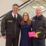 Chief Hagen and Firefighter Williams accept nearly $2,000 in donations made at the till. $6,000 was raised in total at Nordstrom. Photo courtesy of Bellevue Fire Department.