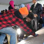 Mayor John Marchione was among many community members to place their handprints in the wet cement below the new sign at the Muslim Association of Puget Sound in Redmond after the mosques old sign was vandalized in 2016. File photo