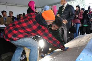 Mayor John Marchione was among many community members to place their handprints in the wet cement below the new sign at the Muslim Association of Puget Sound in Redmond after the mosques old sign was vandalized in 2016. File photo