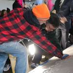 Mayor John Marchione was among many community members to place their handprints in the wet cement below the new sign at the Muslim Association of Puget Sound in Redmond after the mosques old sign was vandalized in 2016. File photoMAPS Sign