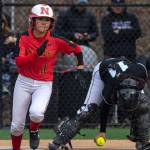 Newport Knights senior Alexis Khauv (pictured) hustles toward first base after laying down a bunt against the Bonney Lake Panthers on March 14 in Factoria. Photo courtesy of Patrick Krohn/Patrick Krohn Photography