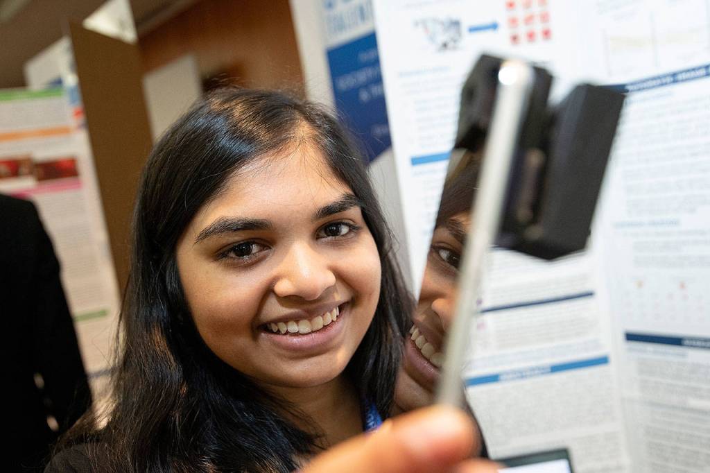 Eshika Saxena won 10th place and $40,000 for her 3D-printed smartphone attachment and artificial intelligence software that automatically identify blood diseases. Photo courtesy of Society Communications Team; Regeneron Science Talent Search.