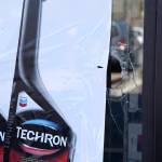 A hole stands in the window at AutoZone, after a shooting on Monday night. Ashley Hiruko/staff photo