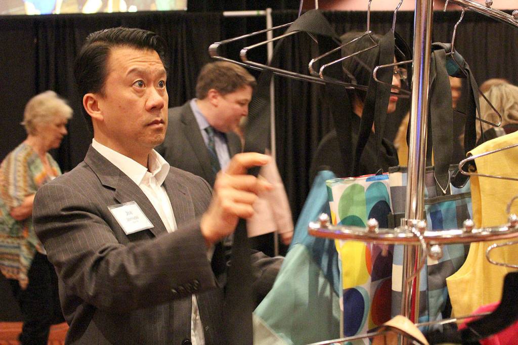 Joe Jornadal shops at Thrift Culture at the Step Up to the Plate luncheon. Thrift Culture proceeds go to Bellevue LifeSpring programs. Madison Miller/staff photo