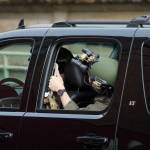 Obamas motorcade, which included armed police guards, waits in the alley behind the Tacoma Public Library on Sunday, March 24. Olivia Sullivan/staff photo