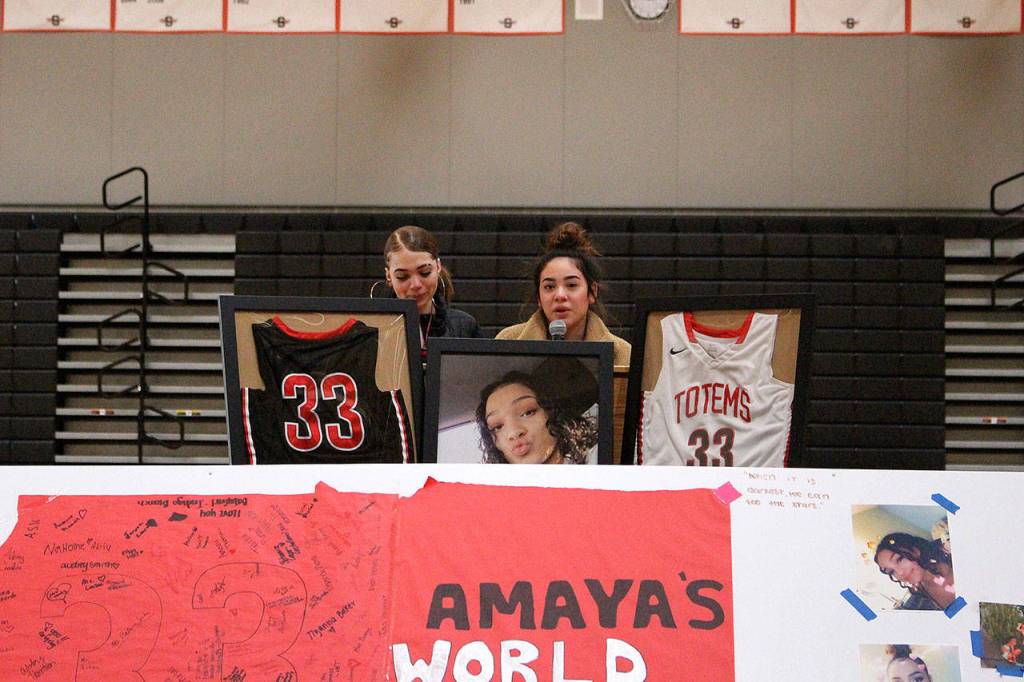 Junior Niya Norris and senior Isabella Flores dedicate a song to Amaya during the March 28 memorial. Madison Miller/staff photo