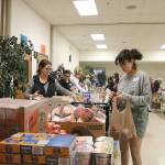 Church members assembled Pantry Packs that were given to the Lake Washington school District for children living in poverty. Stephanie Quiroz/staff photo